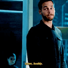 a man says " later buddy " in front of a woman