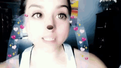 a close up of a woman with hearts on her face
