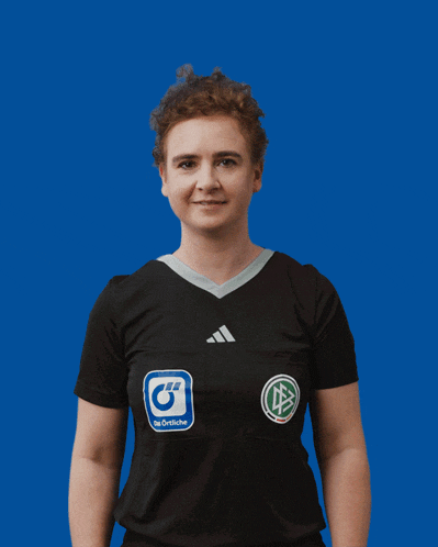 a woman wearing a black shirt with a g on it