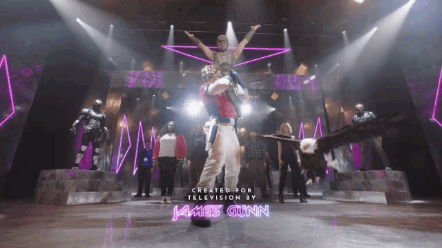 a group of people on a stage with the words created for television by james gunn at the bottom