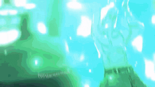 a person 's hand is reaching out towards a bottle of water .