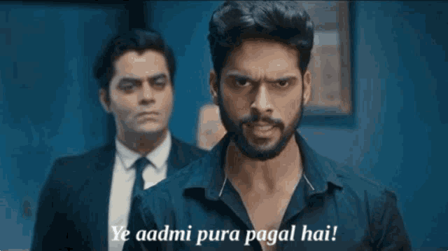 a man with a beard says ye aadmi pura pagal hai in front of another man in a suit