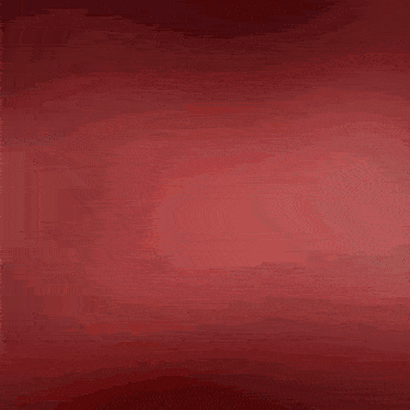 a bunch of strawberries are falling in the air on a red background