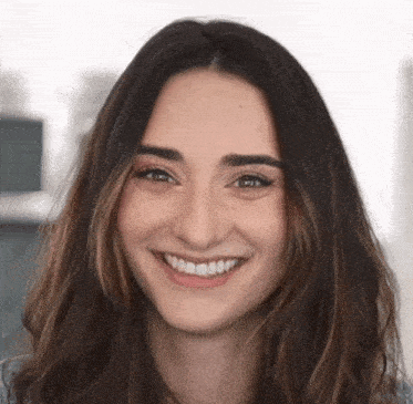 a close up of a woman 's face smiling