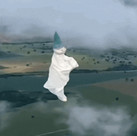 a ghost is flying through the air while wearing a party hat .