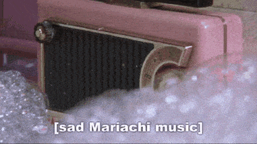a pink radio with the words sad mariachi music written on it