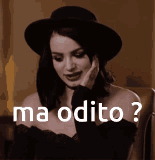 a black and white photo of a woman wearing a hat with the words ma odito written above her