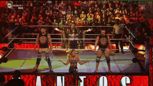 a group of wrestlers are standing in a ring with the word legacy on the bottom