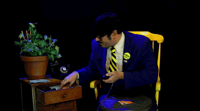a man in a blue suit has a yellow button on his jacket that says " i 'm a democrat "