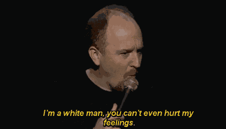 a man is speaking into a microphone and says i 'm a white man you can 't even hurt my feelings