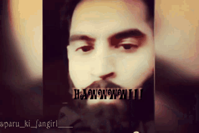 a close up of a man 's face with the words h.a.wow.wow.ii above it
