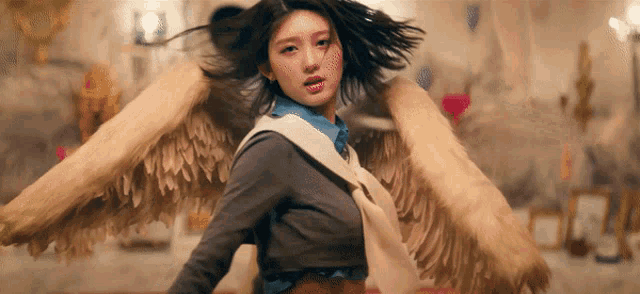 a woman with angel wings on her back