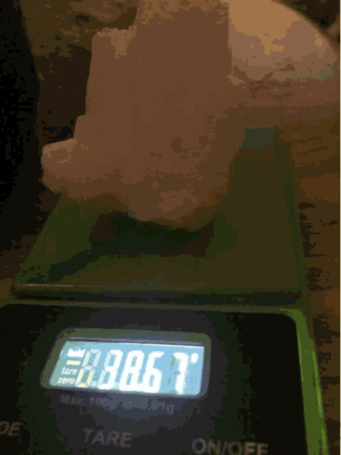 a digital scale displays a weight of 30.67