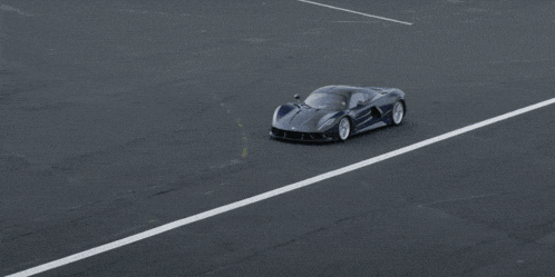 a black sports car with the letter n on it