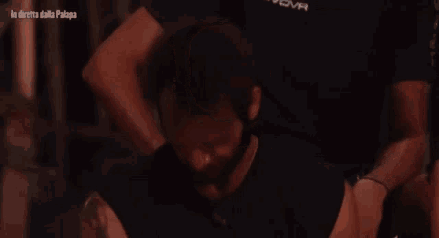 a man with a beard wearing a givova shirt