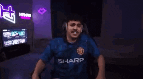 a man wearing headphones and a blue shirt with the word sharp on it .