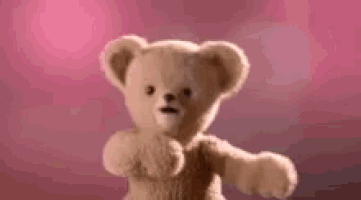 a teddy bear is standing in front of a pink background with the words `` snuggle '' written on it .