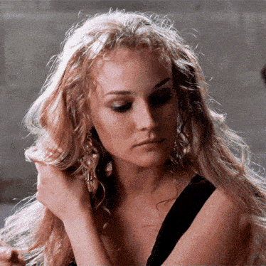 a close up of a woman 's face with blonde hair