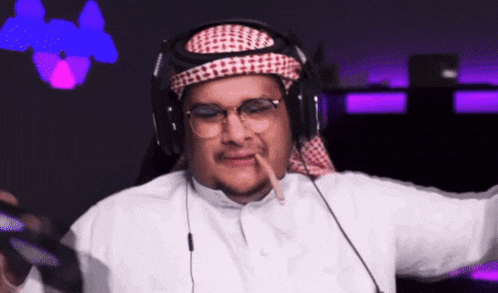 a man wearing glasses and headphones smoking a cigar