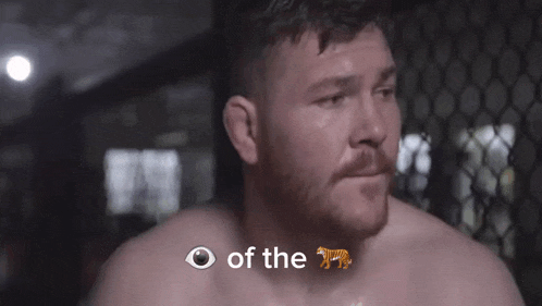 a shirtless man with a tiger on his face and the words of the tiger above him