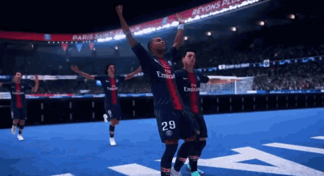 soccer players wearing fly emirates jerseys are celebrating