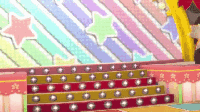 a stage with a colorful striped background and stairs