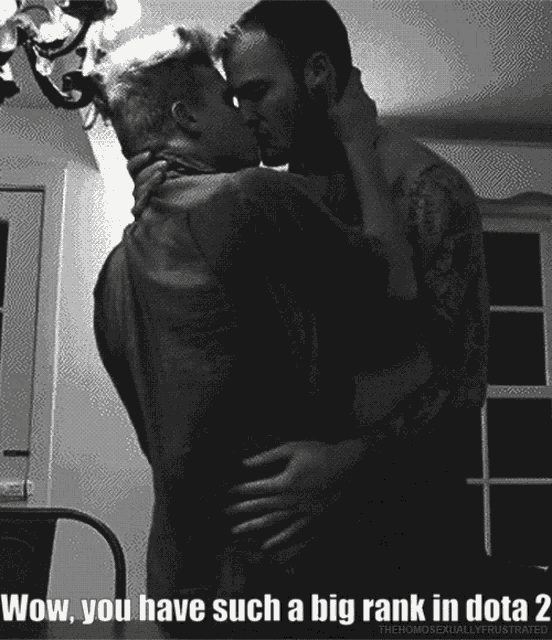a black and white photo of two men kissing with the words wow you have such a big rank in dota 2