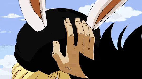 a person with bunny ears covering their face