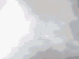 a close up of a waterfall with a lot of fog coming out of it .