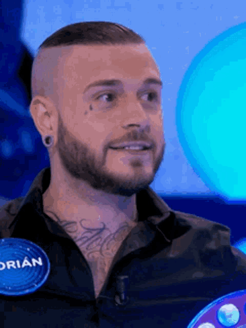 a man with a beard has a name tag that says brian on it