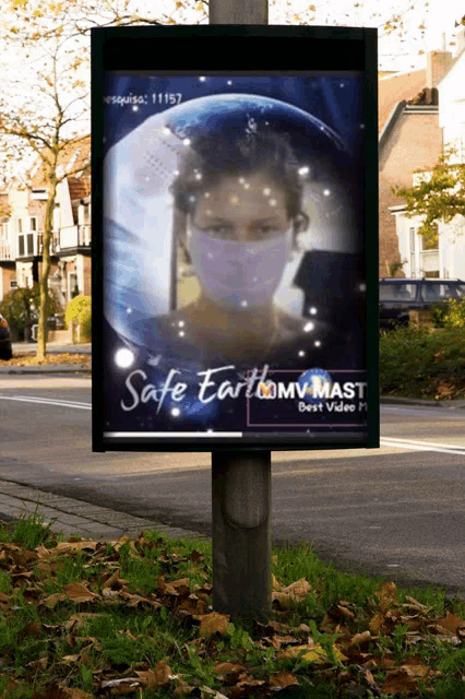 a billboard with a woman wearing a face mask and the words safe earth on it