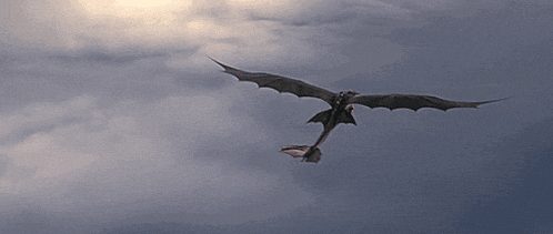 a dragon flying through a cloudy sky with its wings spread