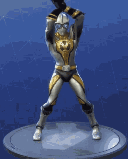 a knight in armor is dancing on a podium .