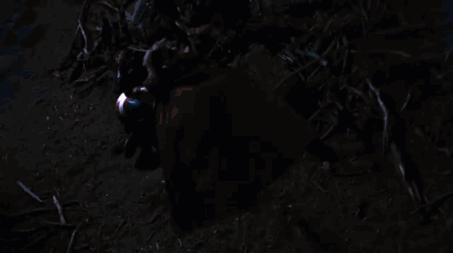 a close up of a person holding a shield with lightning coming from it