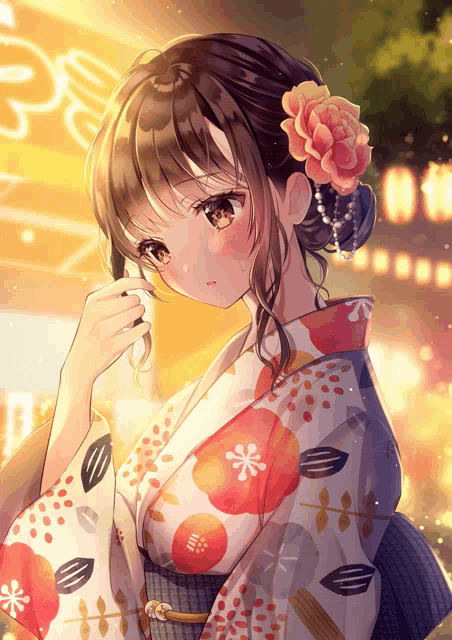 a girl with a flower in her hair is wearing a floral kimono