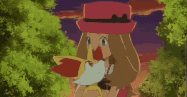 a girl in a pink hat is holding a pokemon in her hand