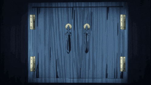 a blue wooden door with gold hinges and a cross on the handles