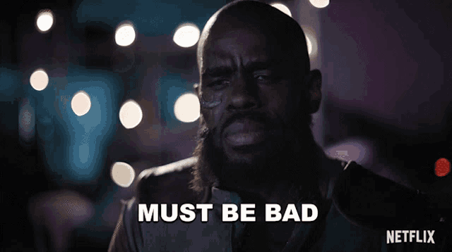 a man with a beard says " must be bad " in front of a netflix logo