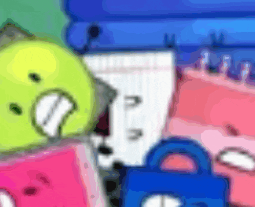 a blurred image of a yellow smiley face sitting on a pink item