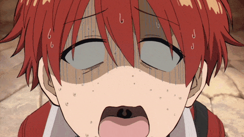a close up of a person 's face with a surprised look on his face