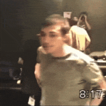 a blurry photo of a man with the time 8:17