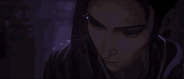 a close up of a woman 's face in a dark room