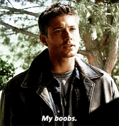 a man in a leather jacket is talking about his boobs
