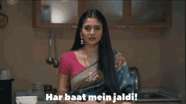 a woman in a saree is standing in a kitchen and says har baat mein jaldi