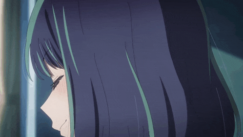 a close up of a girl with blue hair