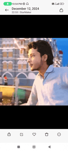 a man is standing in front of a building on december 12th 2024