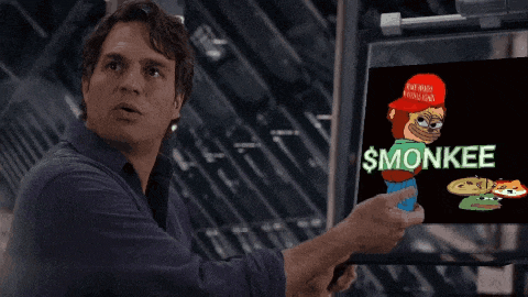 a man points to a screen that says smonkee on it