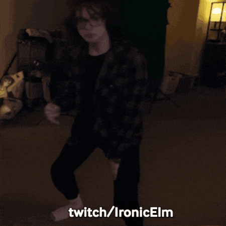 a person is dancing in a dark room with the words twitch / ironicelm written below them