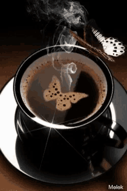 a cup of coffee with a butterfly drawn on it