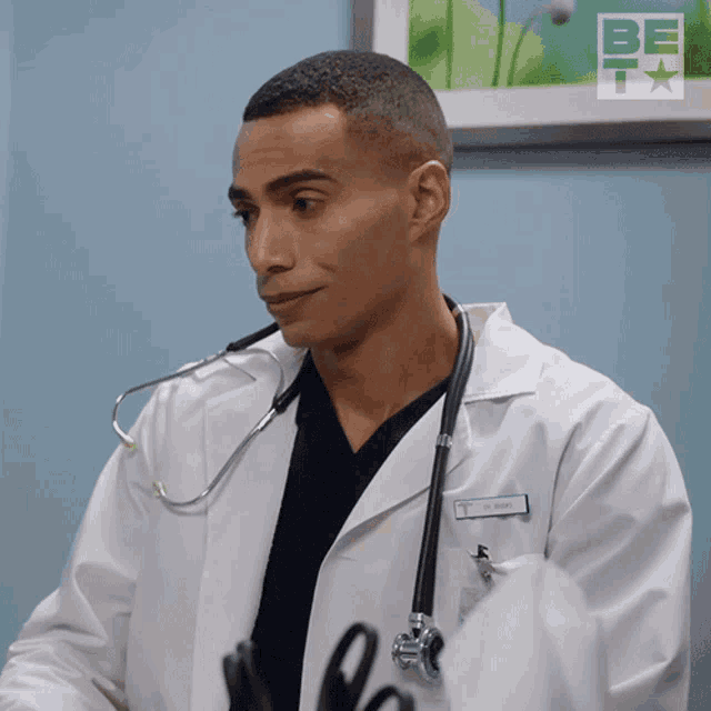 a man in a lab coat with a name tag that says j. wright